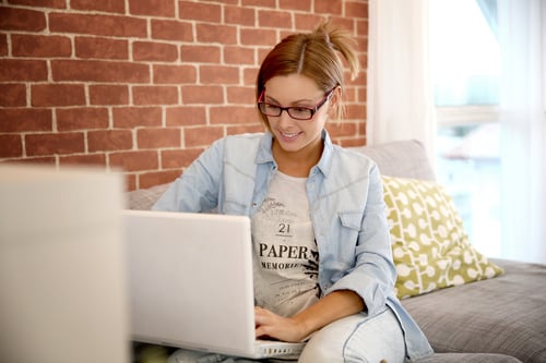 Young woman using laptop computer at home Young woman using laptop computer at home