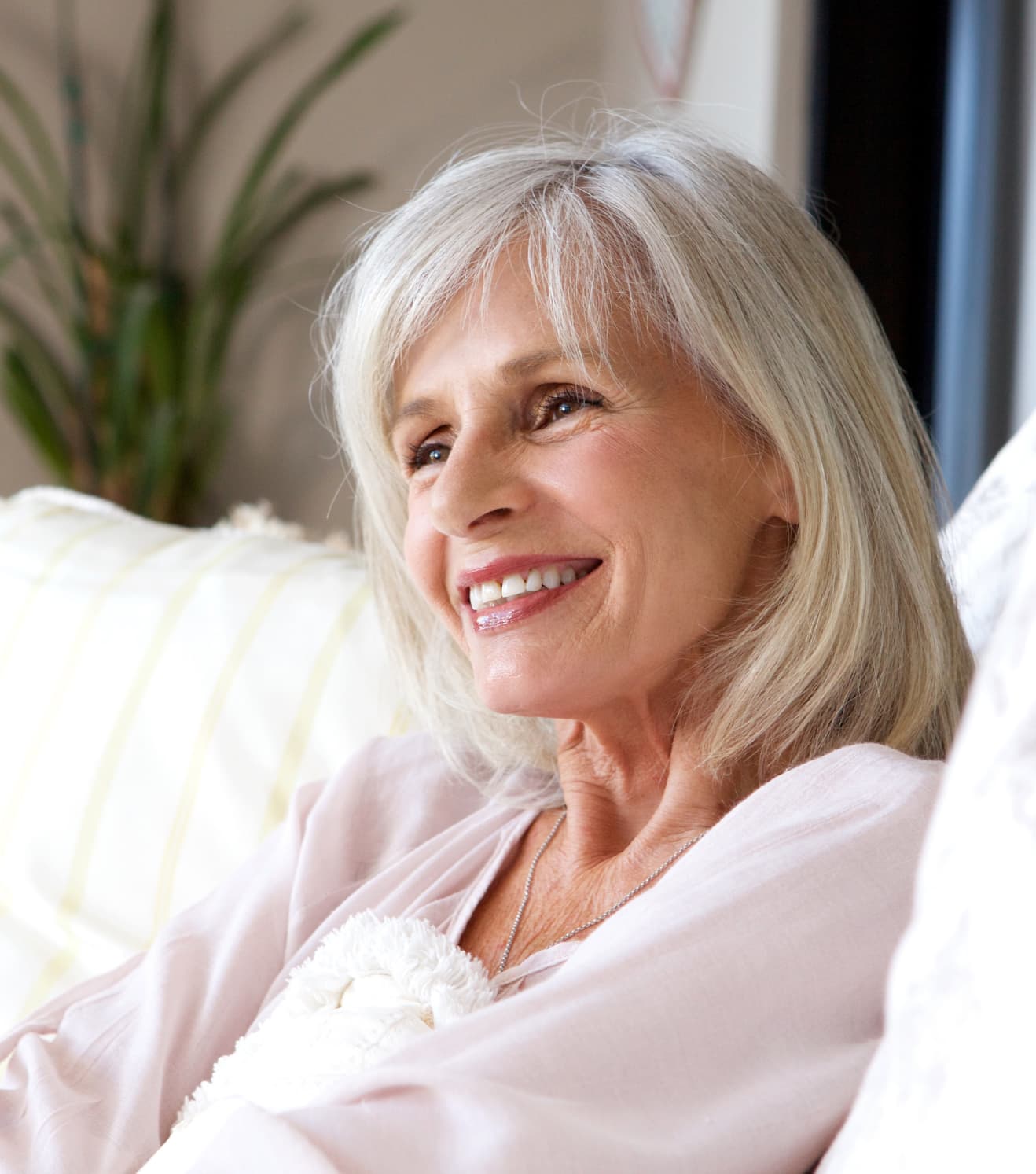 bigstock-Happy-Older-Woman-Sitting-On-C-176718784